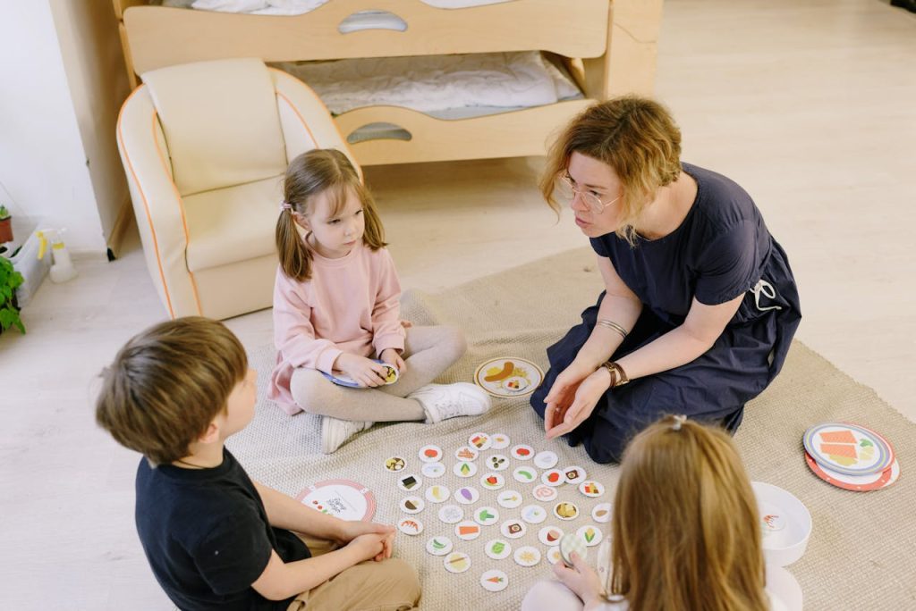 Mother engaging with children in a fun and educational board game at home.